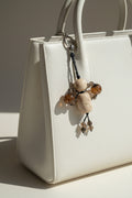 Necklace with stone beads on a fur surface