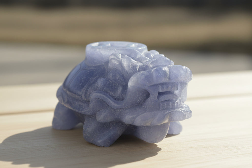 Blue stone lion sculpture on a dark background